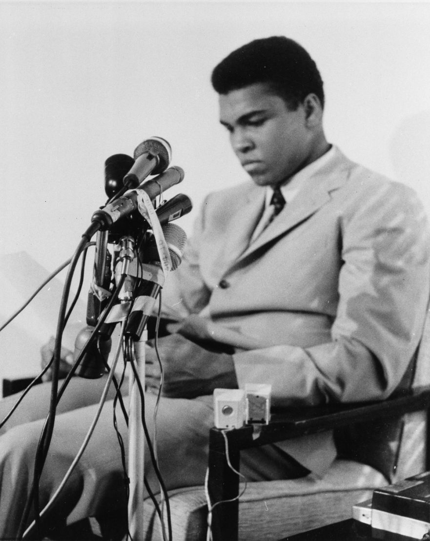 Muhammad Ali is seen at a news conference in Louisville, Kentucky, April 20, 1967, to say he will not accept miltary service of any nature when he is called for induction In Houston on April 28.  He said "I ain't got no quarrel with them Viet Cong," and that the real enemy of his people "is right here" and not in Vietnam or anywhere else.  (AP Photo)